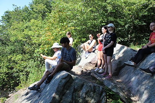 Image of students and faculty sitting at Table Rock on the Appalachian Trail, overlooking Clarks Valley.