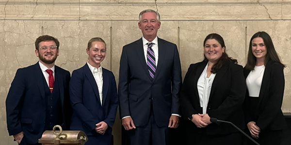 Law students photographed with Montgomery County District Attorney Kevin R. Steele. First place and second place winners standing with the MontCo DA. 