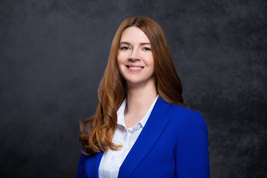 Image of Kerry Pierce wearing blue dress jacket smiling at the camera.