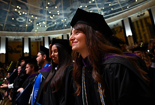 Image of students listening to the speakers at commencement. 