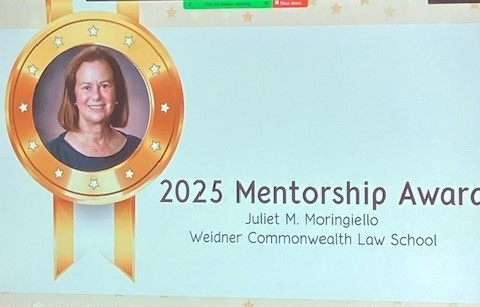  Presentation slide displaying a photo of Juliet M. Moringiello inside a gold medal graphic, accompanied by the text: "2025 Mentorship Award, Juliet M. Moringiello, Widener Commonwealth Law School."