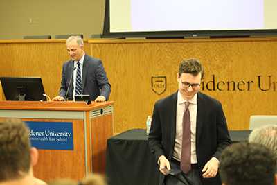 David Duggan receiving a signed copy of the constitution from Judge Bianco.