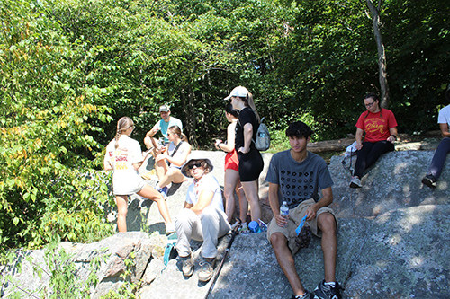 Image of students and faculty sitting at Table Rock on the Appalachian Trail, overlooking Clarks Valley. 