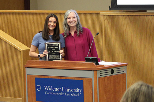 Kiera Flannery and President Stacey Robinson stand together in A180. 