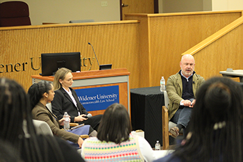 Michael Consedine having a fireside chat with Natalie Solano '26 and Kaylee Caprari '27