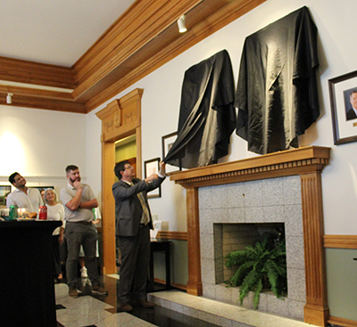 Christian Johnson unveiling his portrait in the Gallery