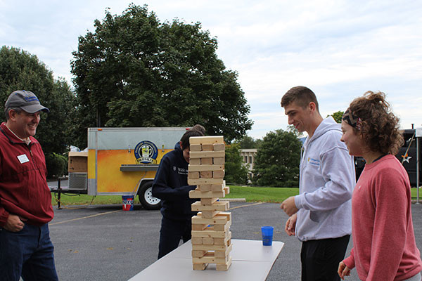 students playing jenga at Dean's picnic