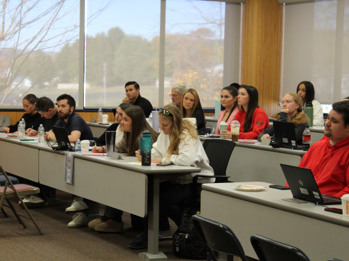 Students and volunteers sitting in a classroom at Widener Law Commonwealth being trained for the Wills for Heroes event