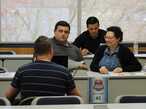 Students and volunteers help draft important documents for our communities heroes