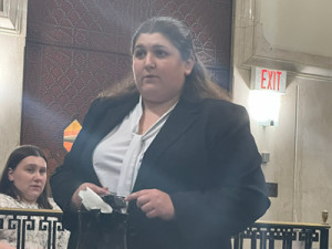 Jessica Poley from Widener University Commonwealth Law School speaking in a courtroom during a mock trial. 