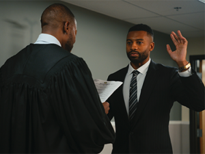 W. Keith Williams III being sworn in by his dad. 