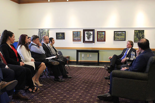 Photo of Don McGahn talking with Widener Law Commonwealth students.