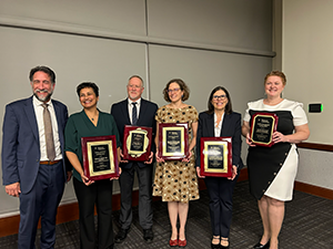 Group photo of award winners along with Amanda Sholtis at the faculty awards ceremony.