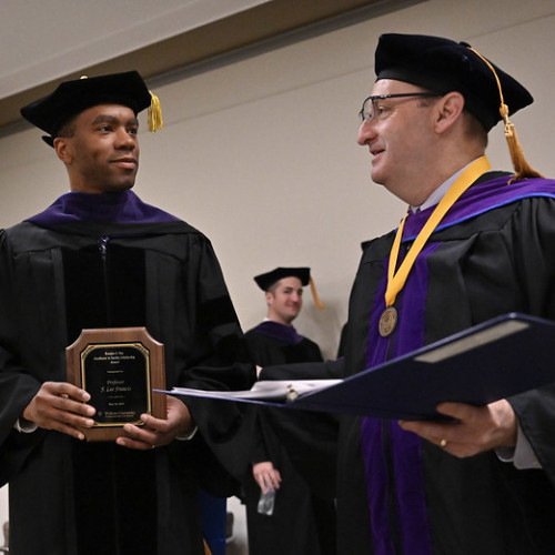F. Lee Francis receiving award. Photographed along side Dean andre douglas pond cummings.