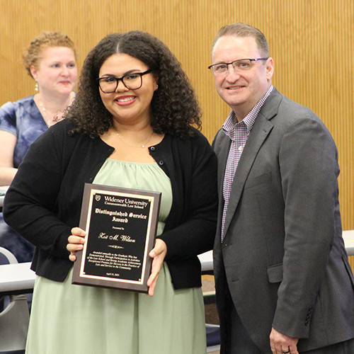 Zoe Wilson and Dean cummings pose in A180 with her award. 