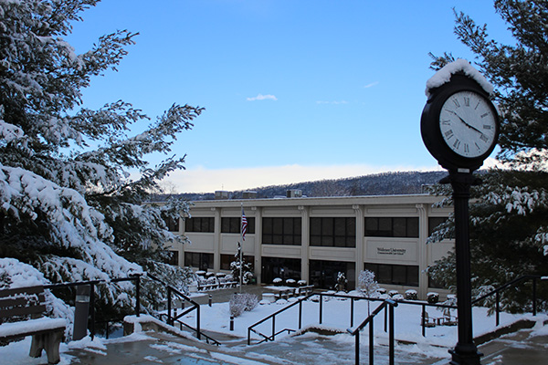 Photo of the law school library building covered in snow.