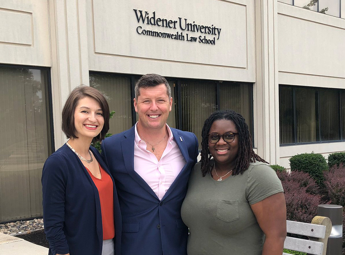 Patrick J. Murphy poses with Murphy Fellows Kimberly Creech and Kathryn Paradise outside the Widener University Commonwealth Law School building.