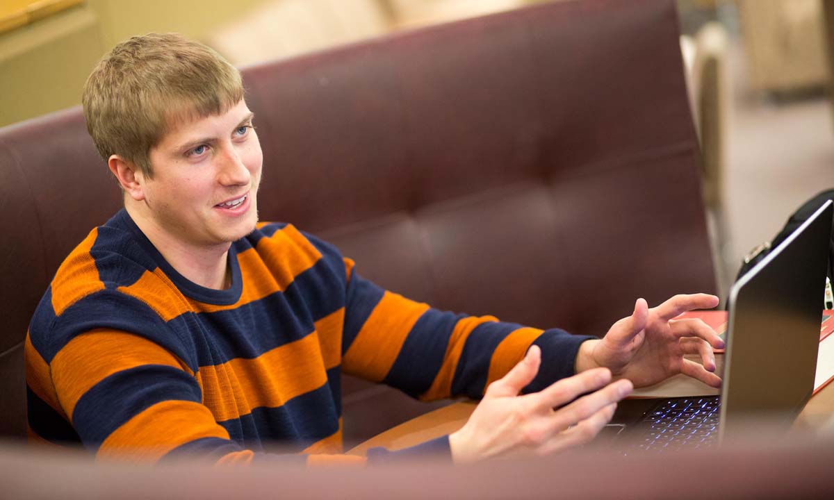 Male student with laptop