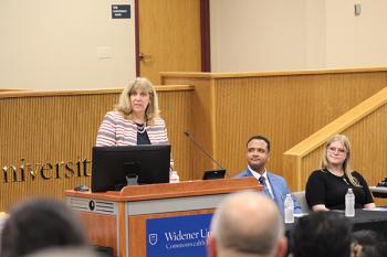 Professor Hemingway speaking at the podium