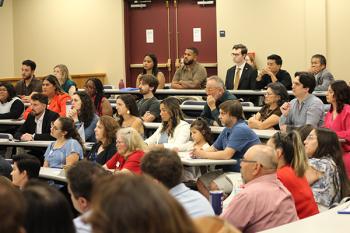 Audience members listening at the 2026 Naturalization Ceremony