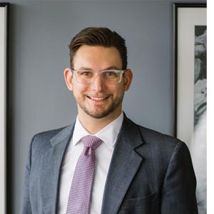 Photo of alumnus in suit.